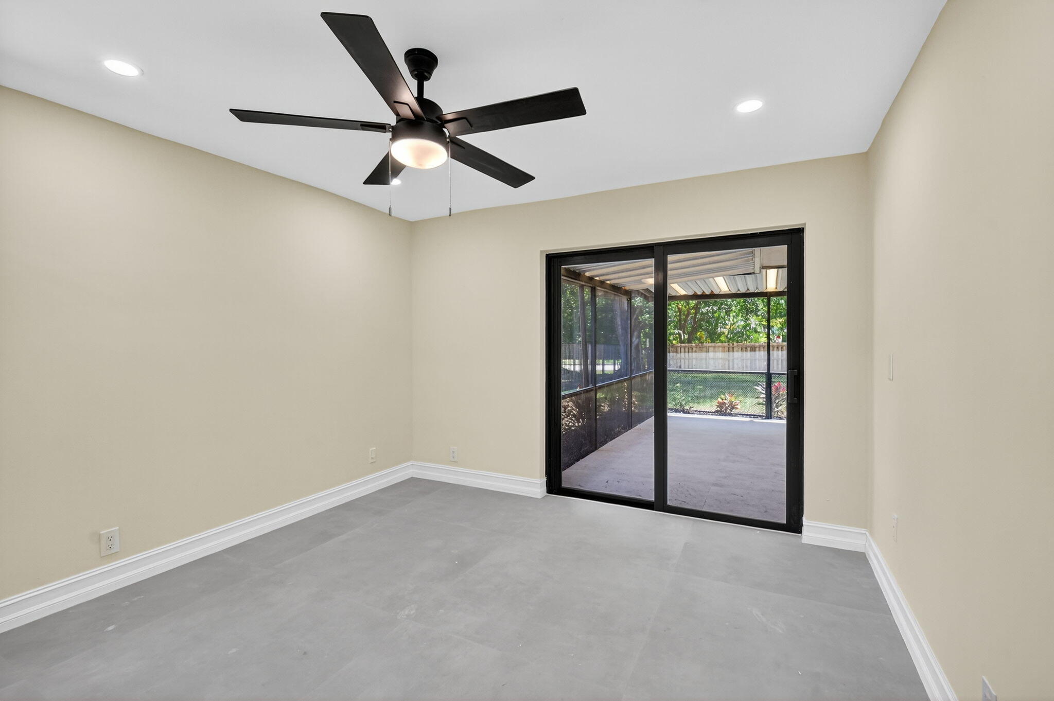 6251 Hitchin Post Way Delray Beach, FL 33484 - Photo 31 of 67 an empty room with ceiling fan and window