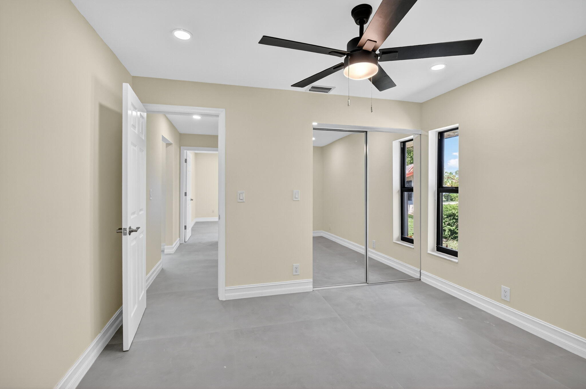 6251 Hitchin Post Way Delray Beach, FL 33484 - Photo 32 of 67 a view of an empty room and a ceiling fan window