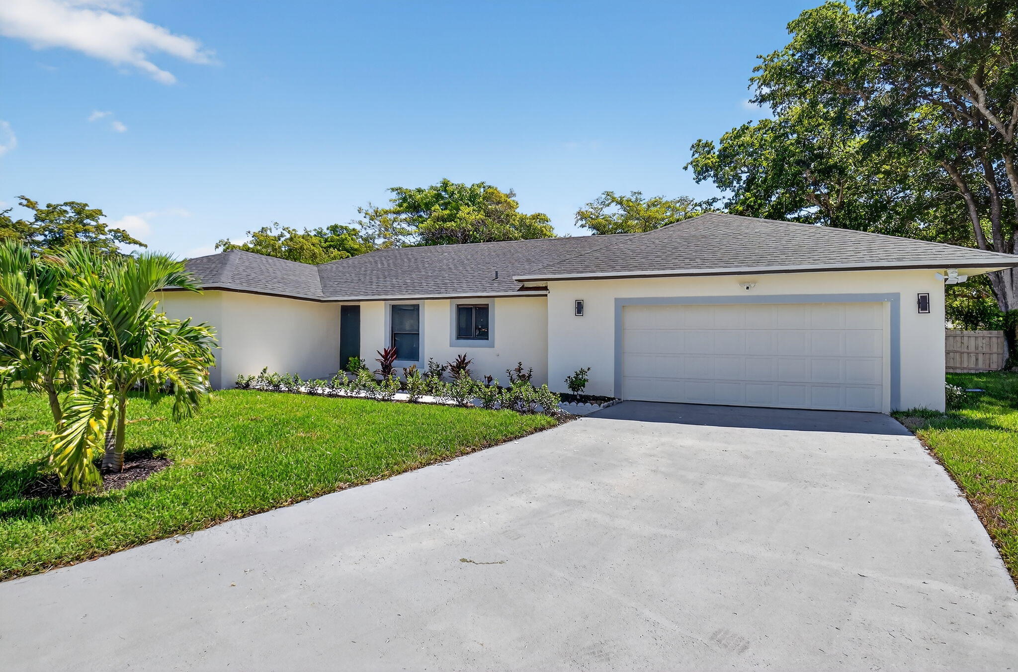 6251 Hitchin Post Way Delray Beach, FL 33484 - Photo 61 of 67 a front view of a house with a yard and garage