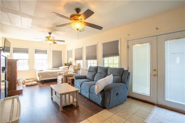 a living room with furniture and a large window