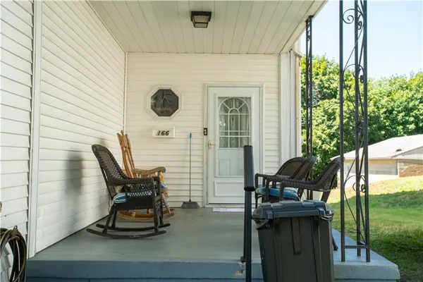 a view of two chairs in the balcony