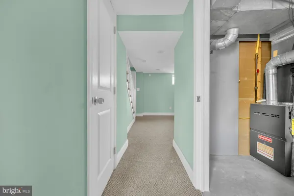 a view of a hallway with wooden shelves