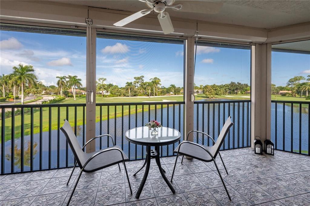 413 Augusta Boulevard, Unit 302 Naples, FL 34113 - Photo 29 of 39 a view of a porch with furniture and a yard