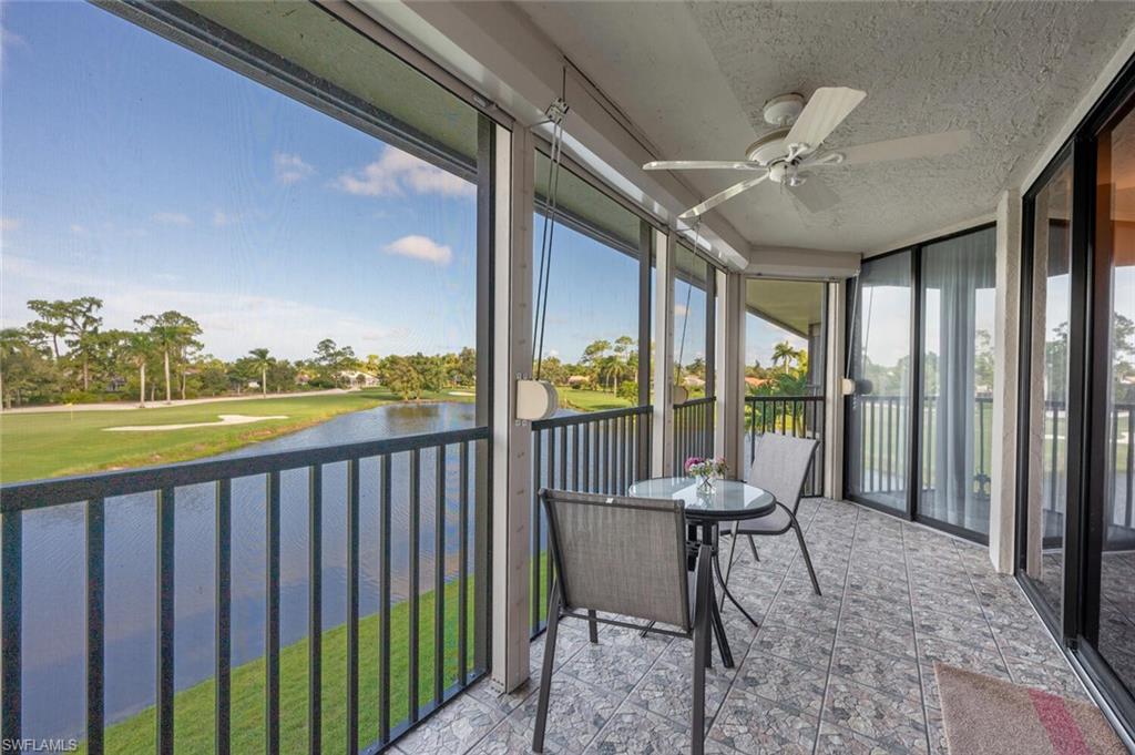 413 Augusta Boulevard, Unit 302 Naples, FL 34113 - Photo 32 of 39 a view of a porch with furniture and a yard