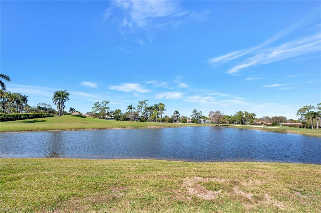 413 Augusta Boulevard, Unit 302 Naples, FL 34113 - Photo 33 of 39 a view of lake with houses