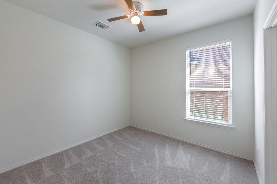 2950 East Old Settlers Boulevard, Unit 82 Round Rock, TX 78665 - Photo 18 of 31 a view of an empty room with a window