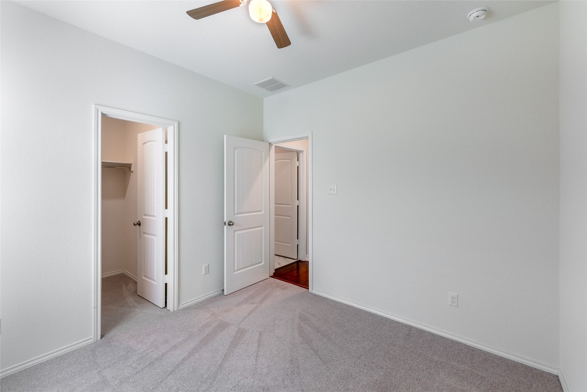 2950 East Old Settlers Boulevard, Unit 82 Round Rock, TX 78665 - Photo 19 of 31 wooden floor in an empty room