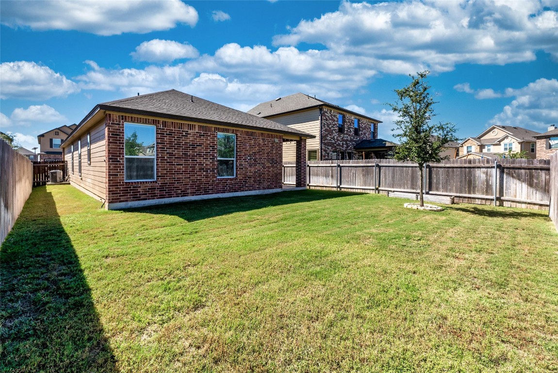 2950 East Old Settlers Boulevard, Unit 82 Round Rock, TX 78665 - Photo 23 of 31 a house view with a garden space