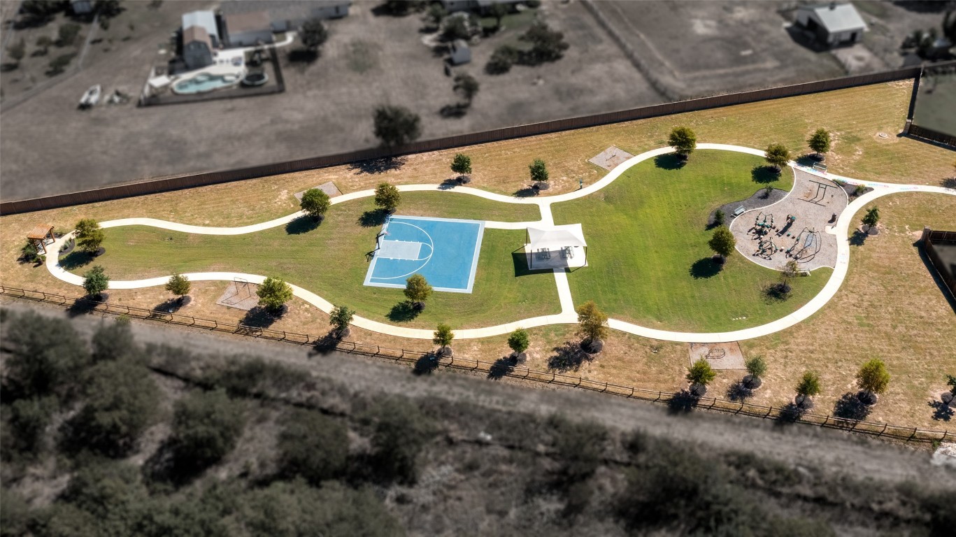 2950 East Old Settlers Boulevard, Unit 82 Round Rock, TX 78665 - Photo 26 of 31 an aerial view of a house with a swimming pool