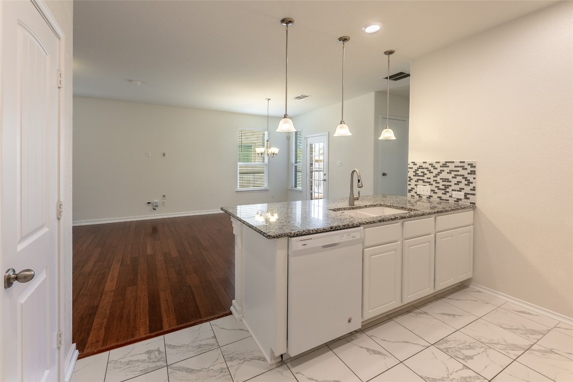 2950 East Old Settlers Boulevard, Unit 82 Round Rock, TX 78665 - Photo 31 of 31 a bathroom with a double vanity sink a mirror and a shower