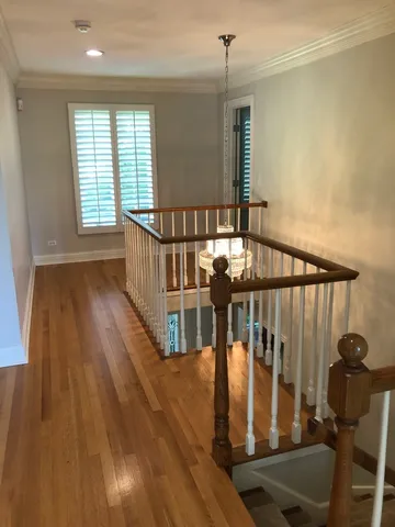 a view of entryway with wooden floor
