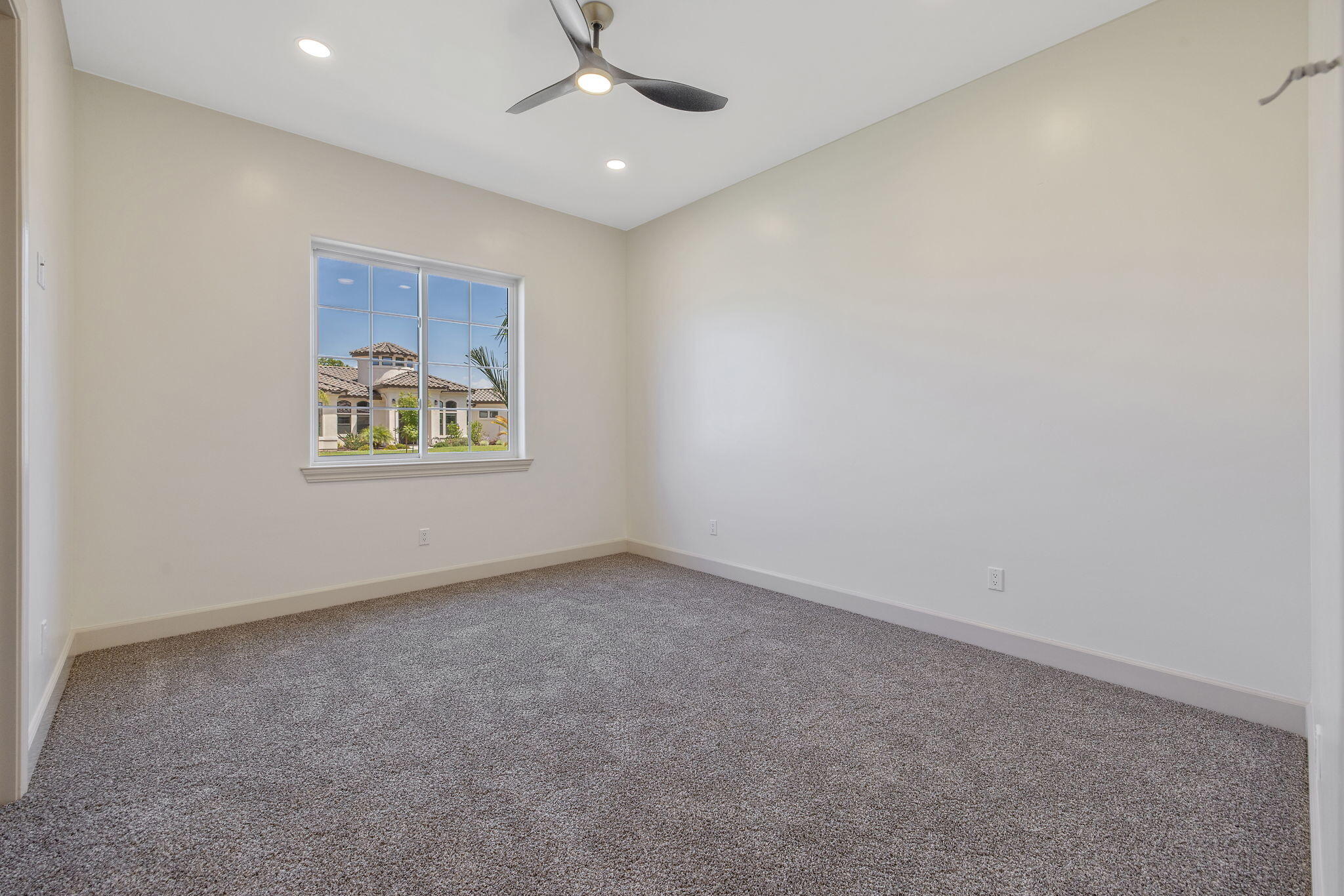 503 East Palm Street Exeter, CA 93221 - Photo 56 of 92 an empty room with a ceiling fan and window