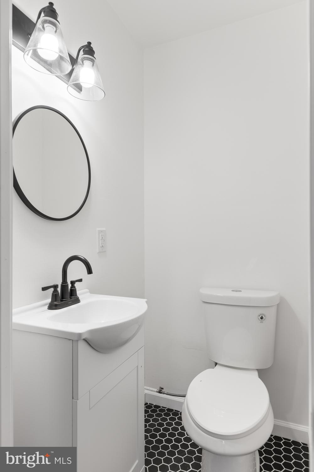 7 Cedarhurst Circle Lancaster, PA 17603 - Photo 12 of 24 a bathroom with a toilet a sink and a mirror