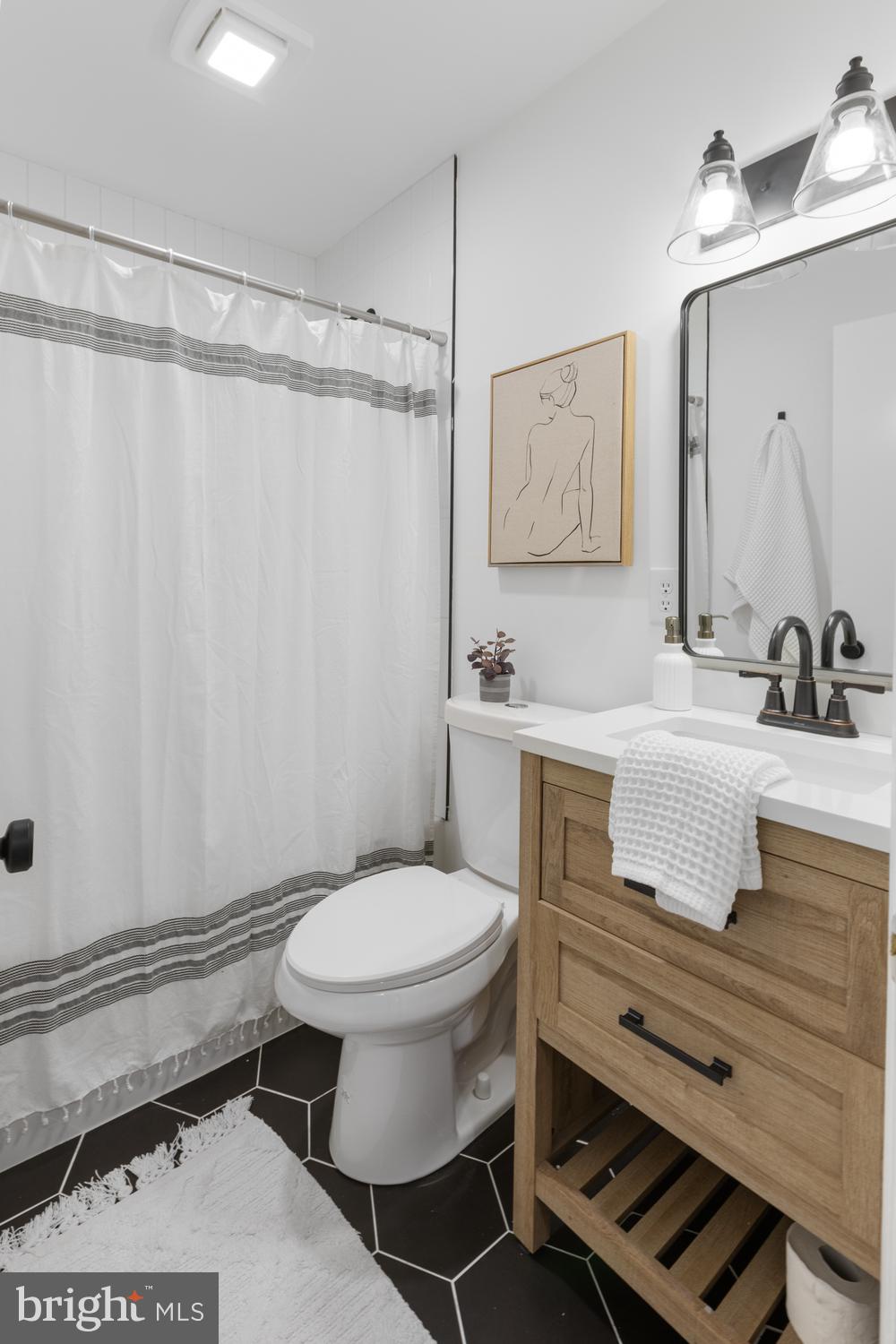7 Cedarhurst Circle Lancaster, PA 17603 - Photo 13 of 24 a bathroom with a sink toilet and shower