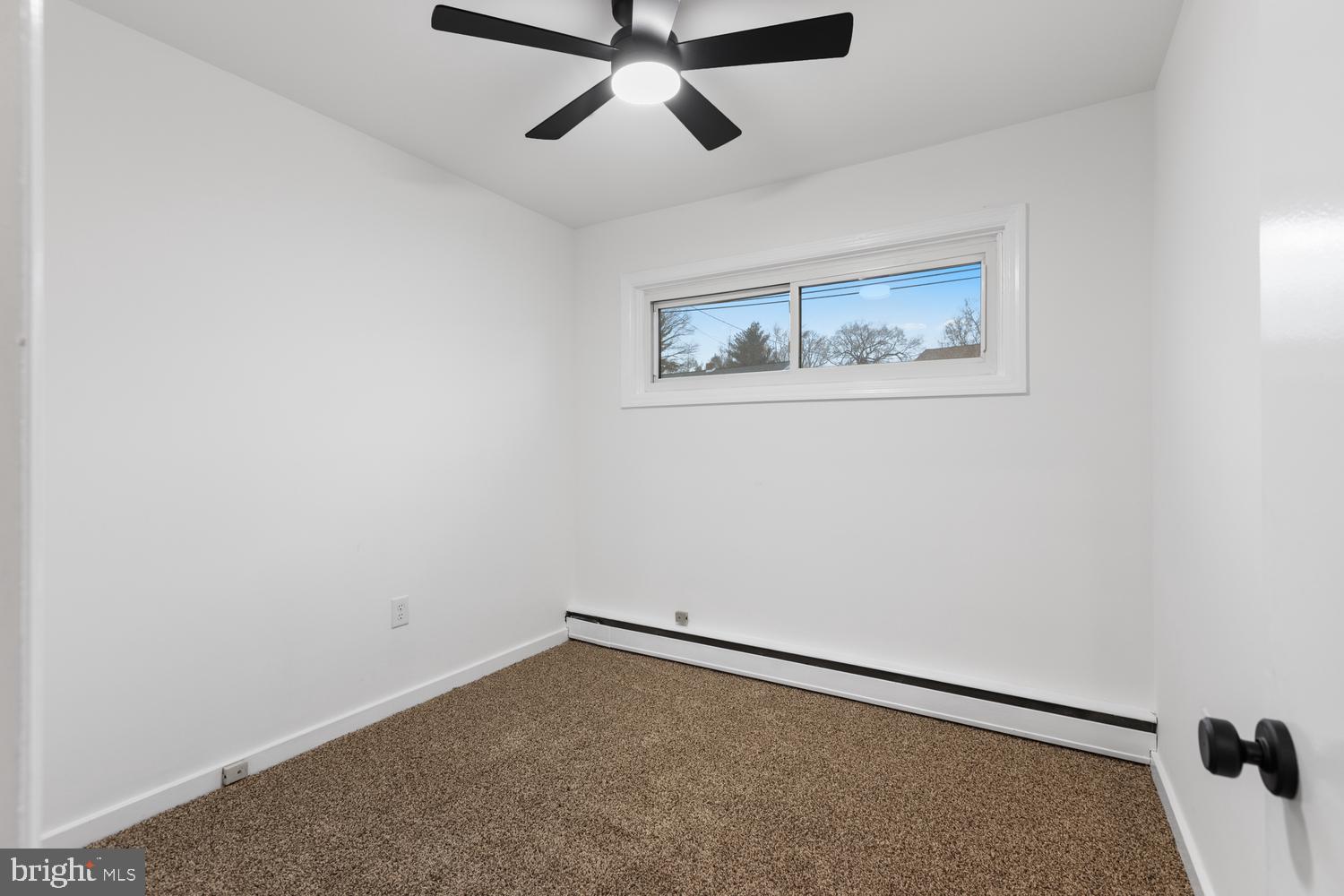7 Cedarhurst Circle Lancaster, PA 17603 - Photo 18 of 24 an empty room with a window and ceiling fan