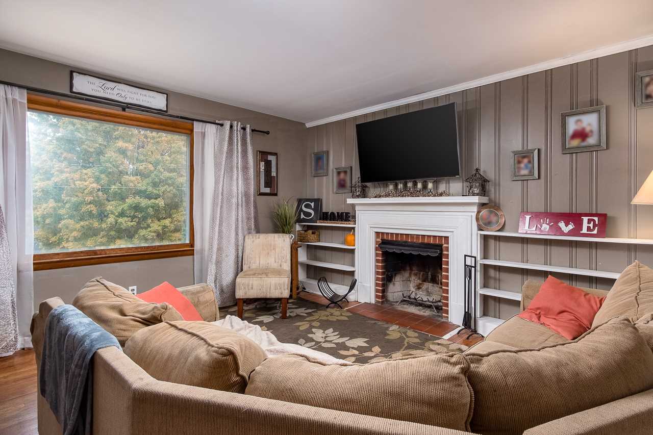 100 Nottingham Road Staunton, VA 24401 - Photo 16 of 50 a living room with furniture a flat screen tv and a fireplace