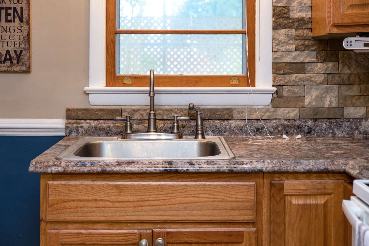 100 Nottingham Road Staunton, VA 24401 - Photo 27 of 50 a kitchen sink with granite countertop a sink and a window