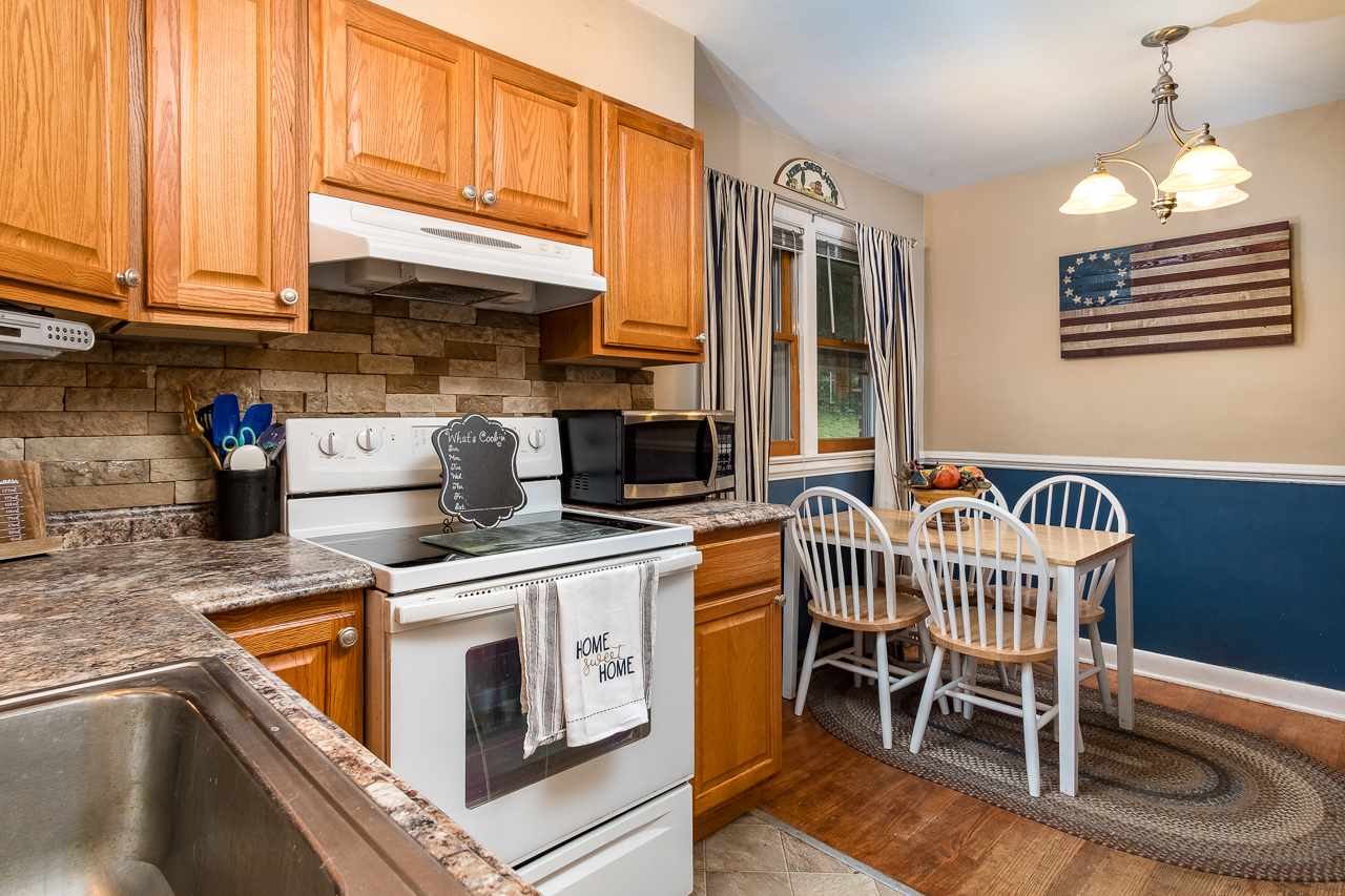 100 Nottingham Road Staunton, VA 24401 - Photo 30 of 50 a kitchen with a stove a table and chairs