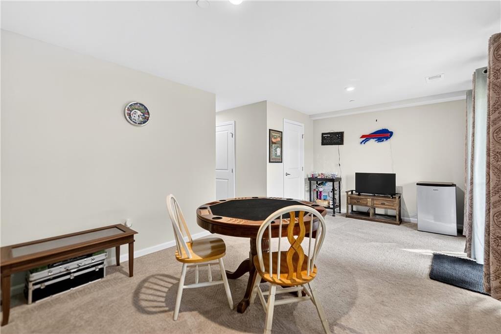 2019 Cade Drive Monaca, PA 15061 - Photo 12 of 37 a living room with furniture a flat screen tv and a fireplace