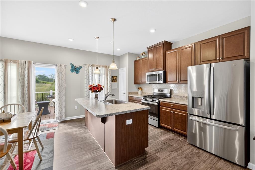 2019 Cade Drive Monaca, PA 15061 - Photo 15 of 37 a kitchen with stainless steel appliances granite countertop a refrigerator a sink dishwasher a stove and a refrigerator