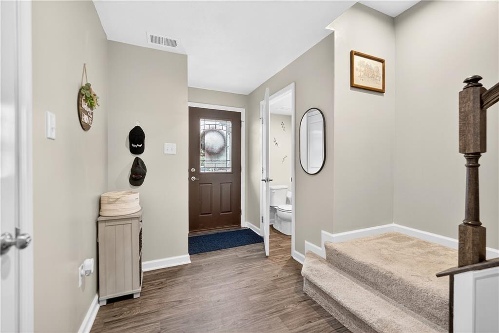 2019 Cade Drive Monaca, PA 15061 - Photo 8 of 37 a spacious bedroom with a bed and a chandelier