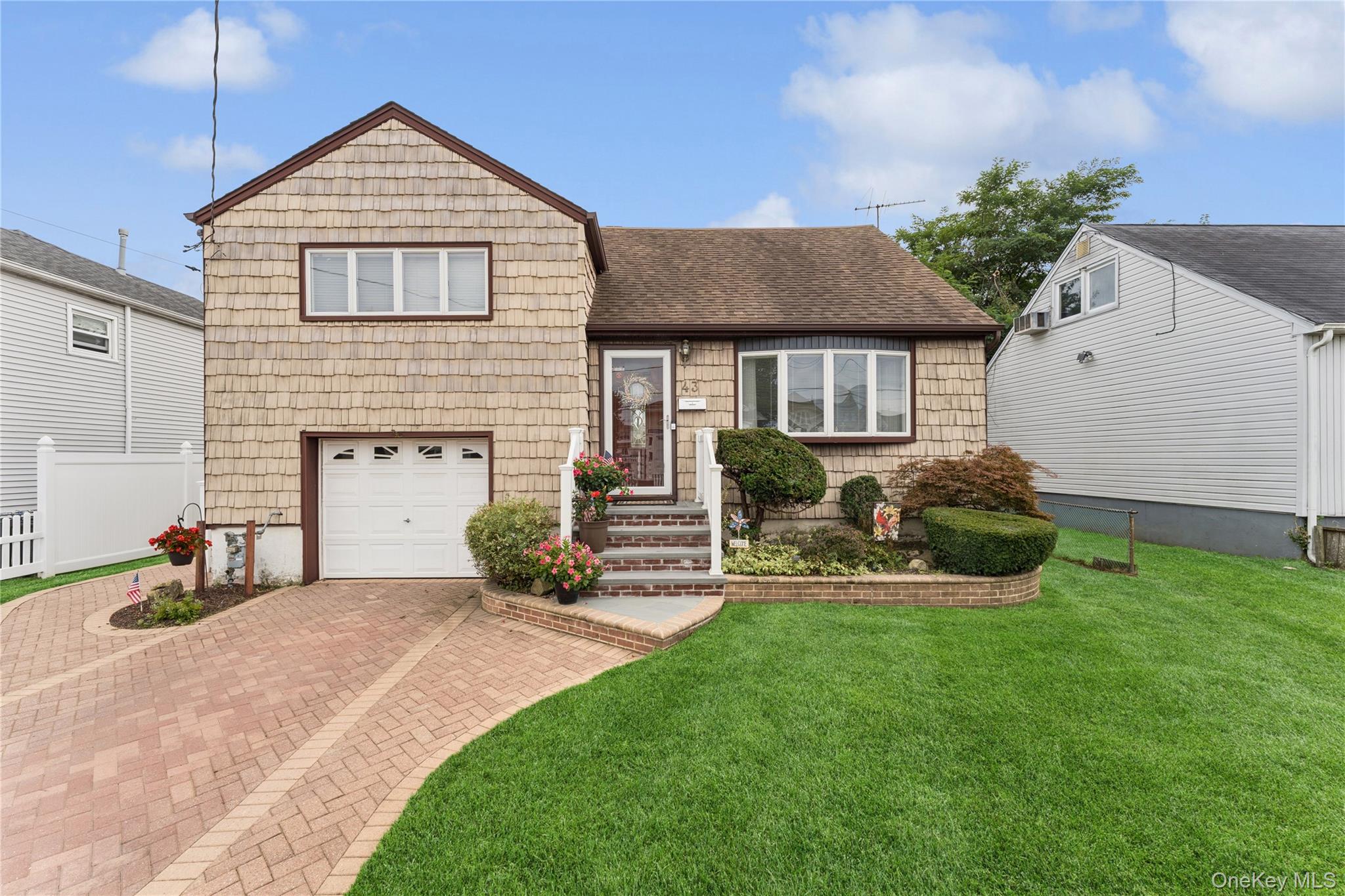 43 Layton Street Freeport, NY 11520 - Photo 1 of 1 a view of a house with a yard and sitting area