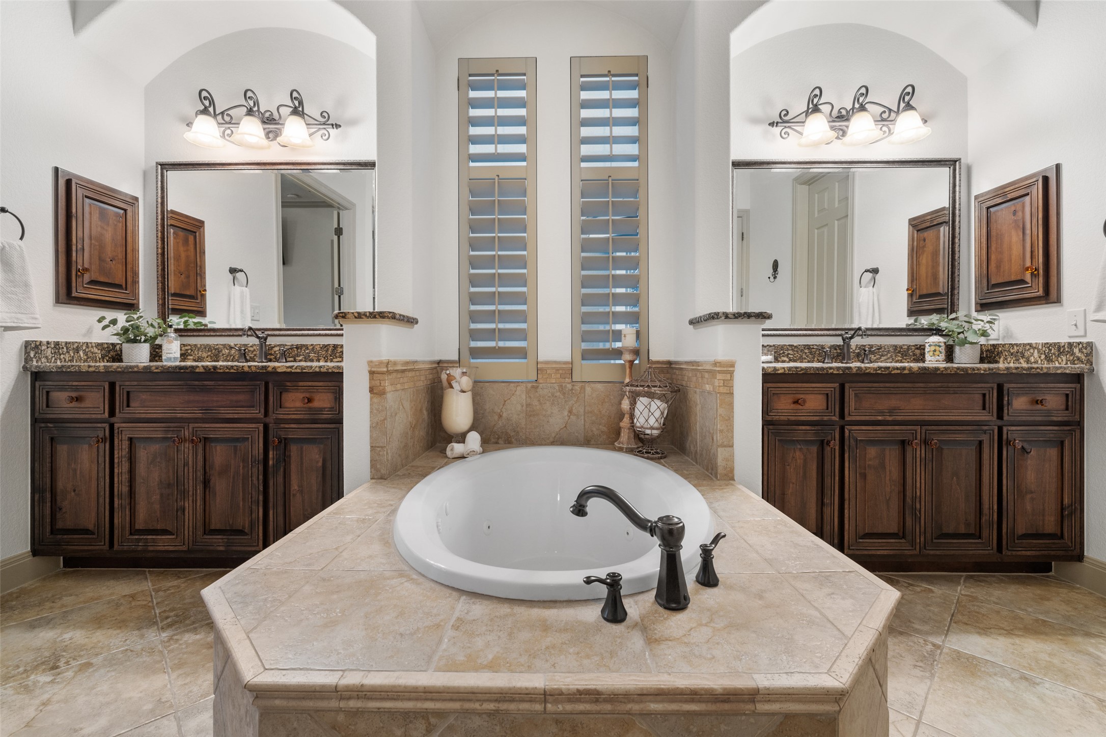 4105 Vail Divide Austin, TX 78738 - Photo 11 of 40 a bathroom with a sink double vanity and a mirror