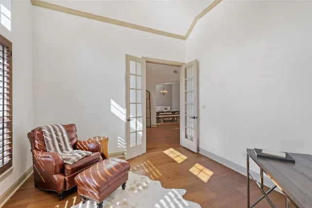 a kitchen with kitchen island a dining table and chairs