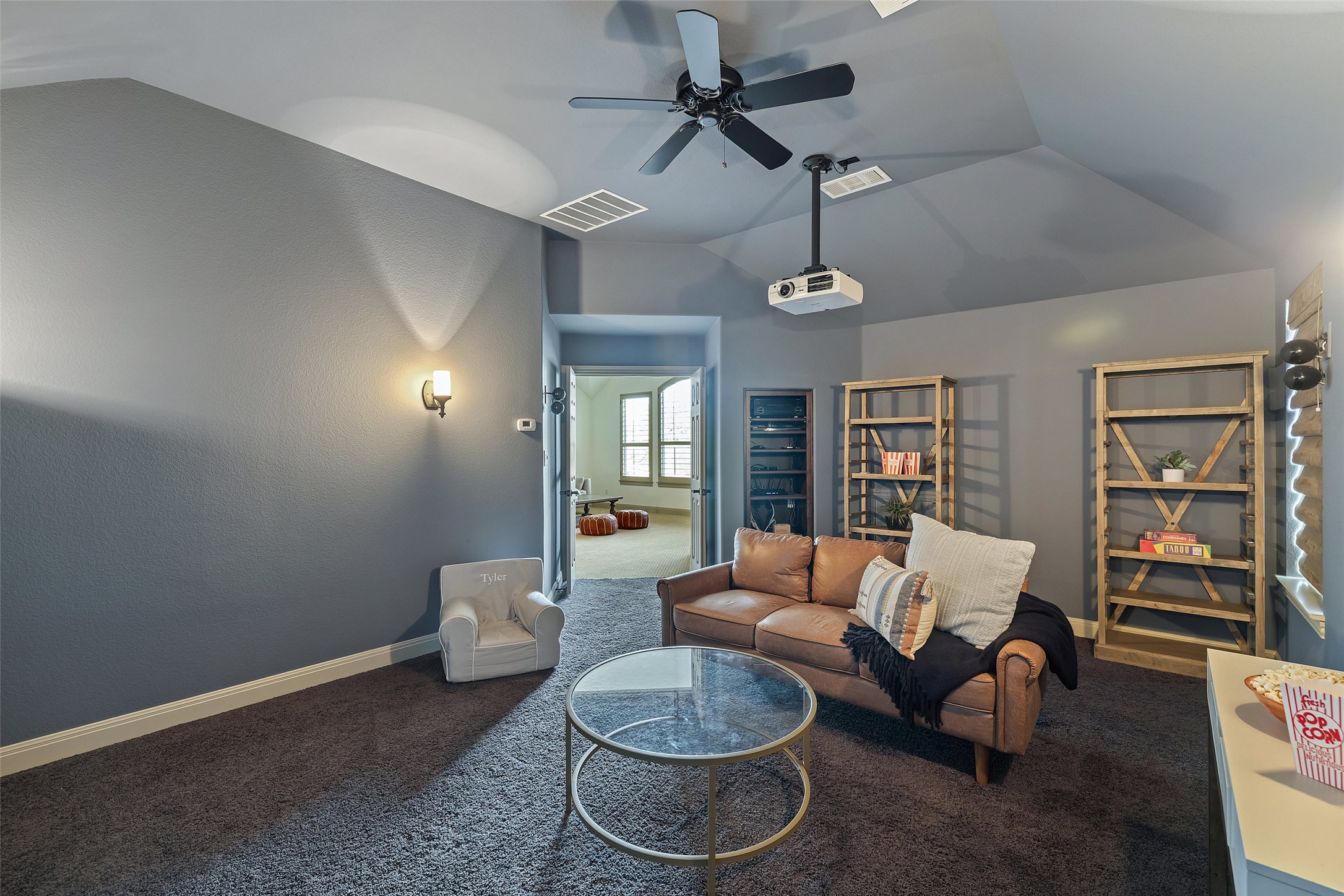 4105 Vail Divide Austin, TX 78738 - Photo 33 of 40 a living room with furniture and a wooden floor
