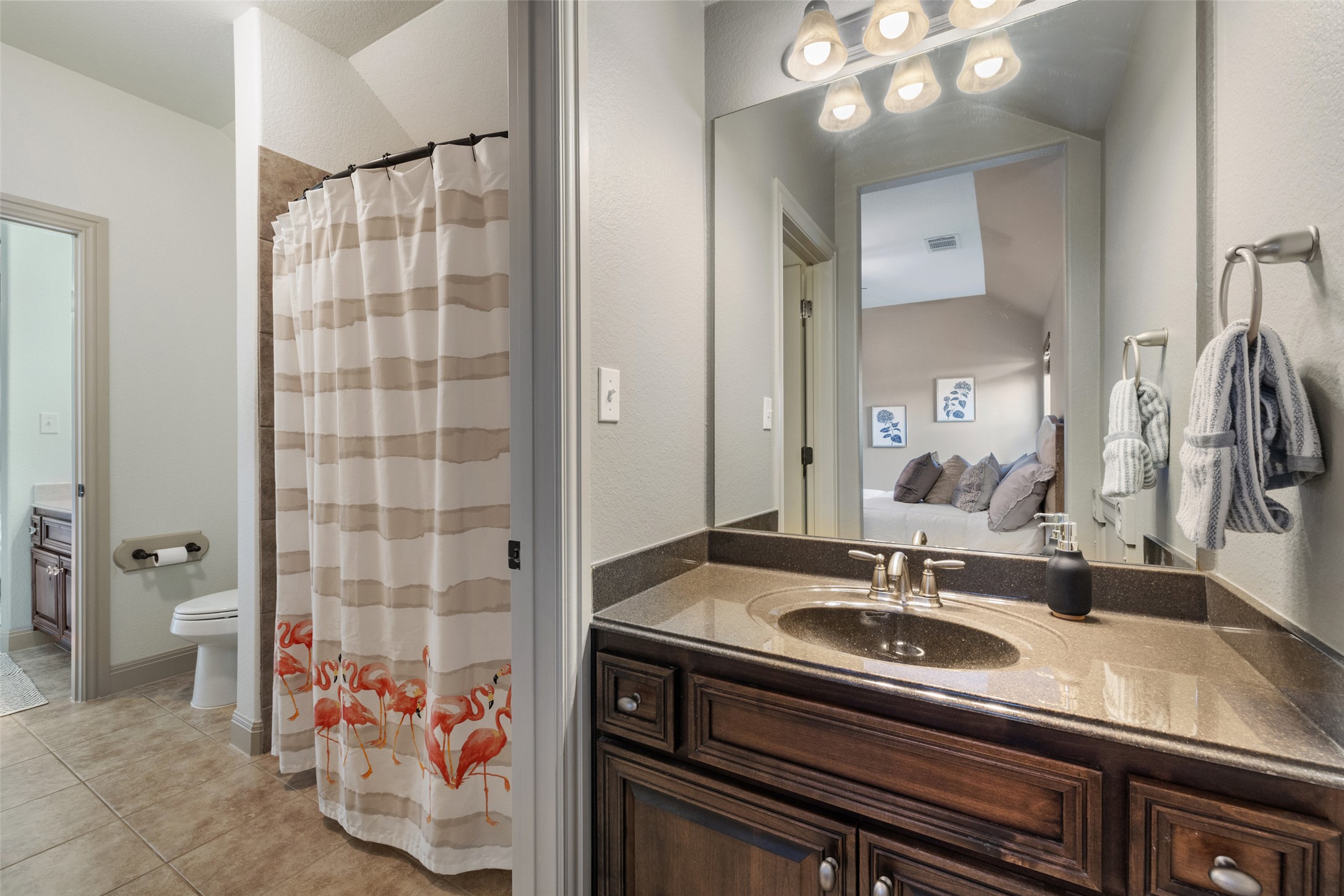 4105 Vail Divide Austin, TX 78738 - Photo 35 of 40 a bathroom with a sink and a mirror