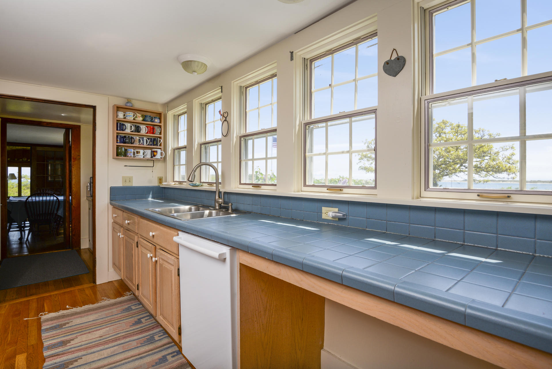 55 Sears Point Road Chatham, MA 02633 - Photo 11 of 26 a kitchen with stainless steel appliances granite countertop a sink and a stove