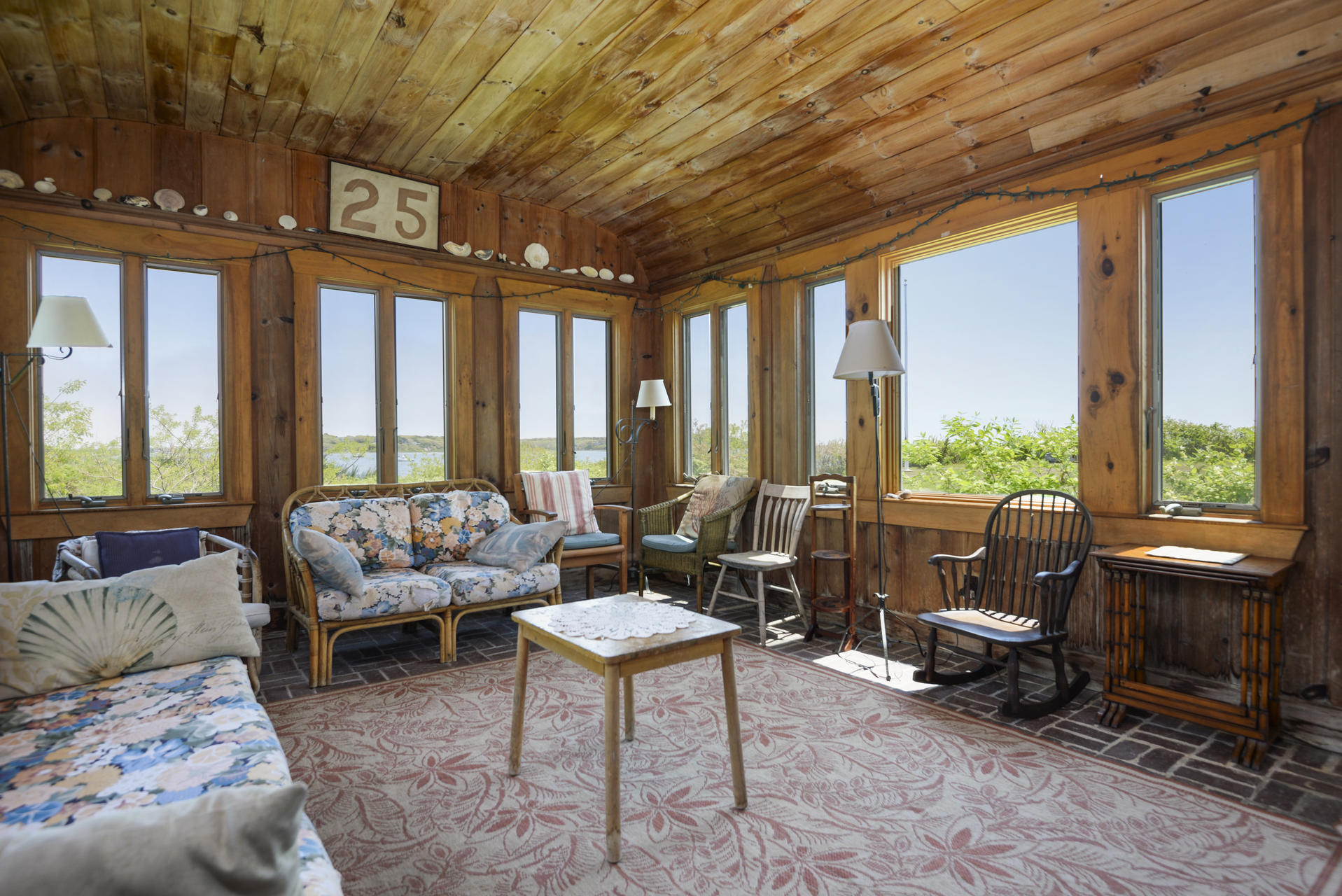 55 Sears Point Road Chatham, MA 02633 - Photo 12 of 26 a living room with furniture and a large window