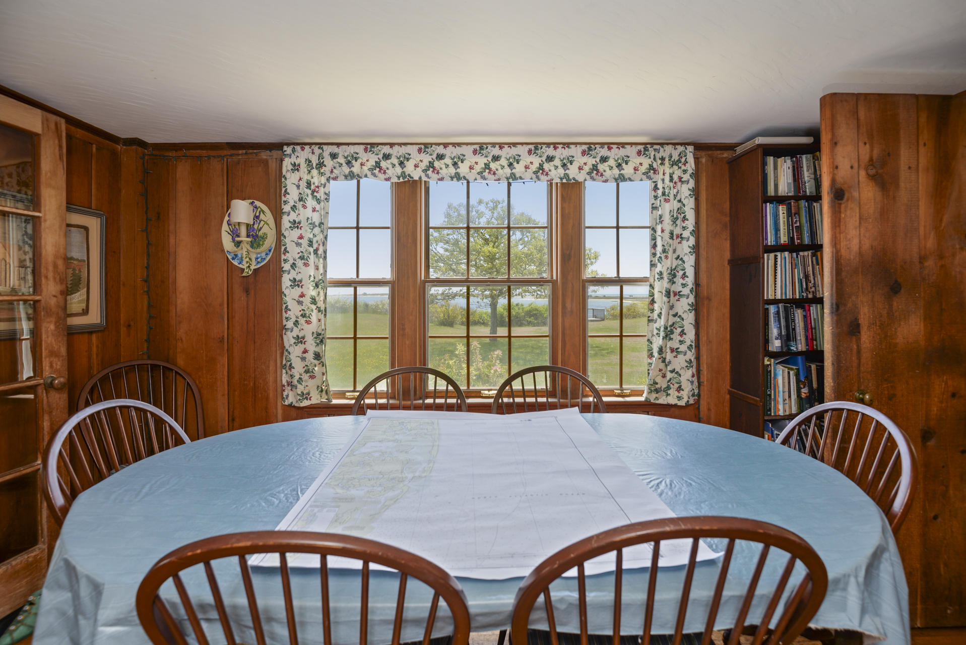 55 Sears Point Road Chatham, MA 02633 - Photo 13 of 26 a view of a dining room with furniture window and outside view