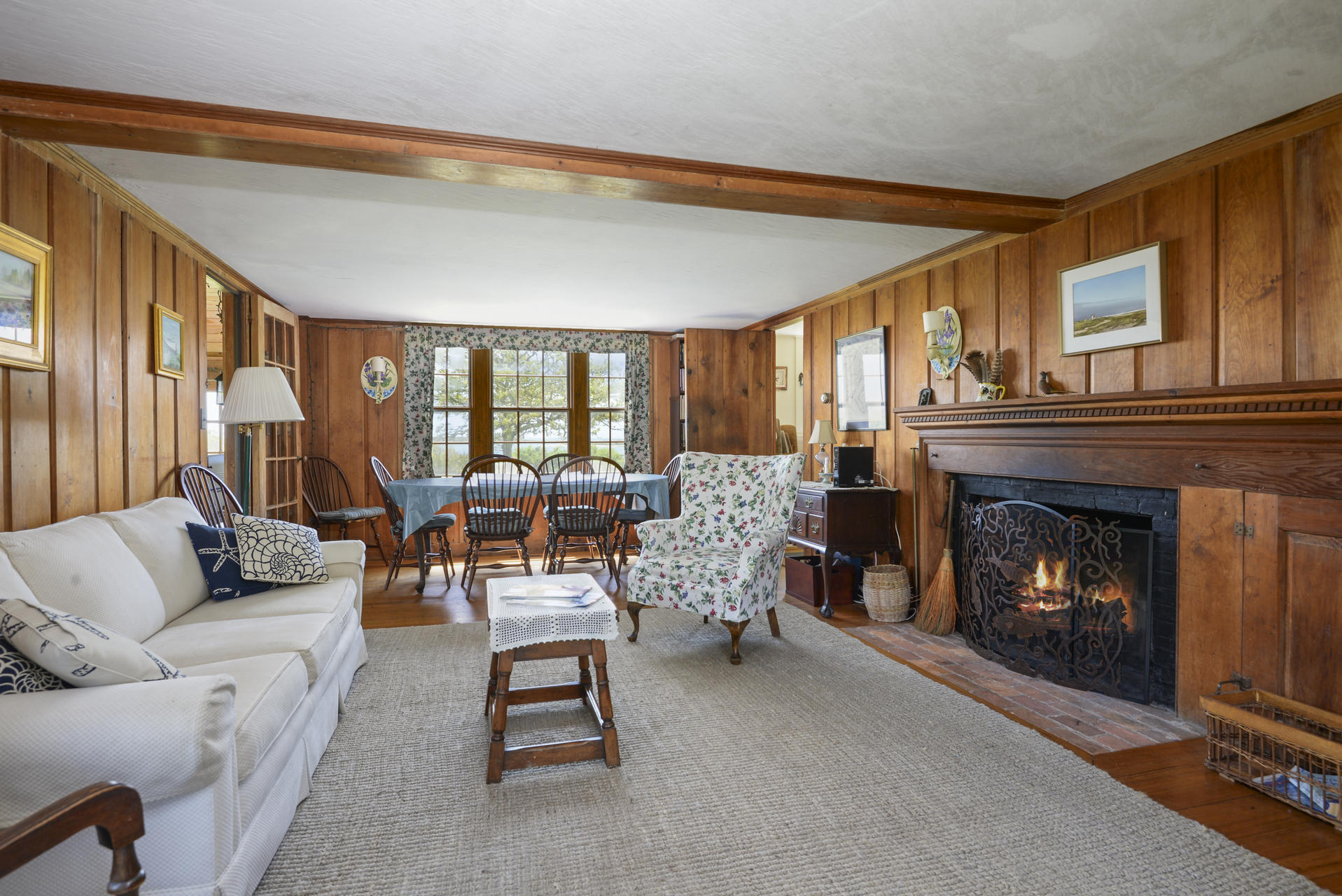 55 Sears Point Road Chatham, MA 02633 - Photo 14 of 26 a living room with furniture and a fireplace