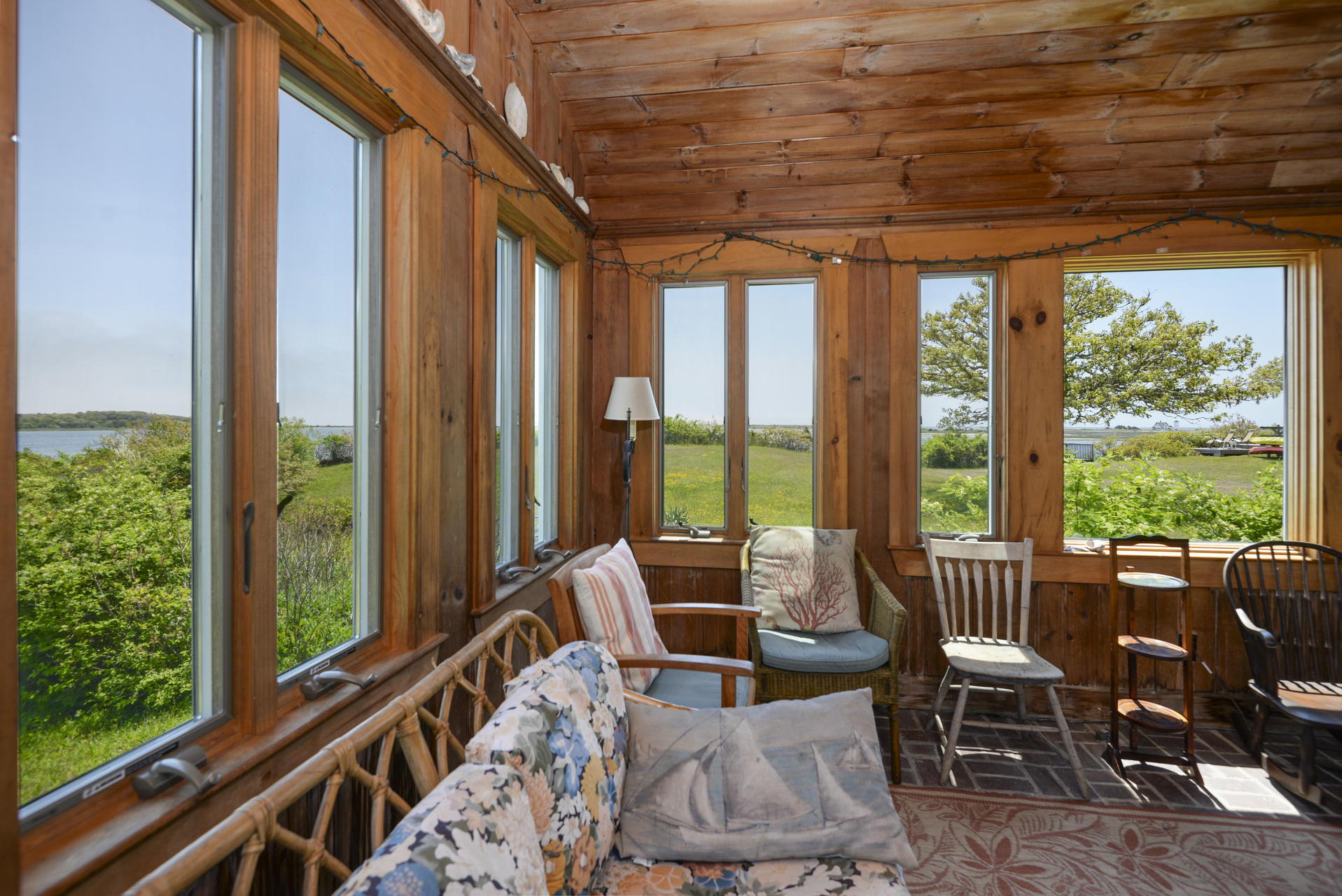 55 Sears Point Road Chatham, MA 02633 - Photo 16 of 26 a living room with large windows and furniture