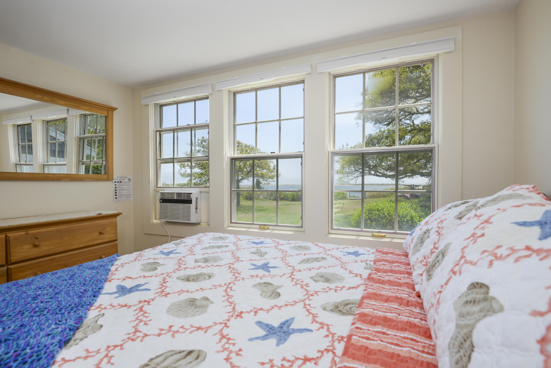 55 Sears Point Road Chatham, MA 02633 - Photo 17 of 26 a bedroom with a bed and wooden floor