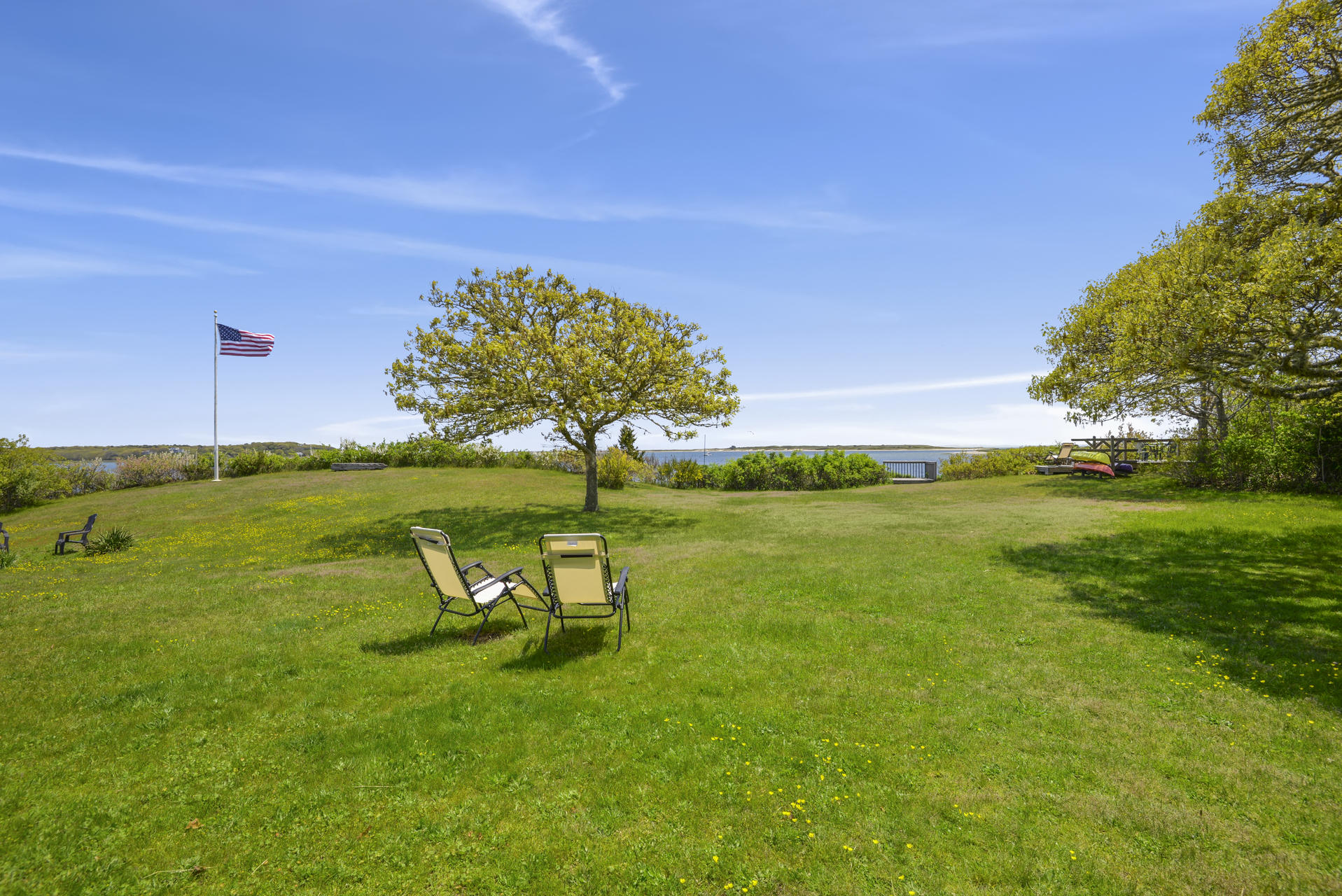55 Sears Point Road Chatham, MA 02633 - Photo 25 of 26 a view of a lake with a yard