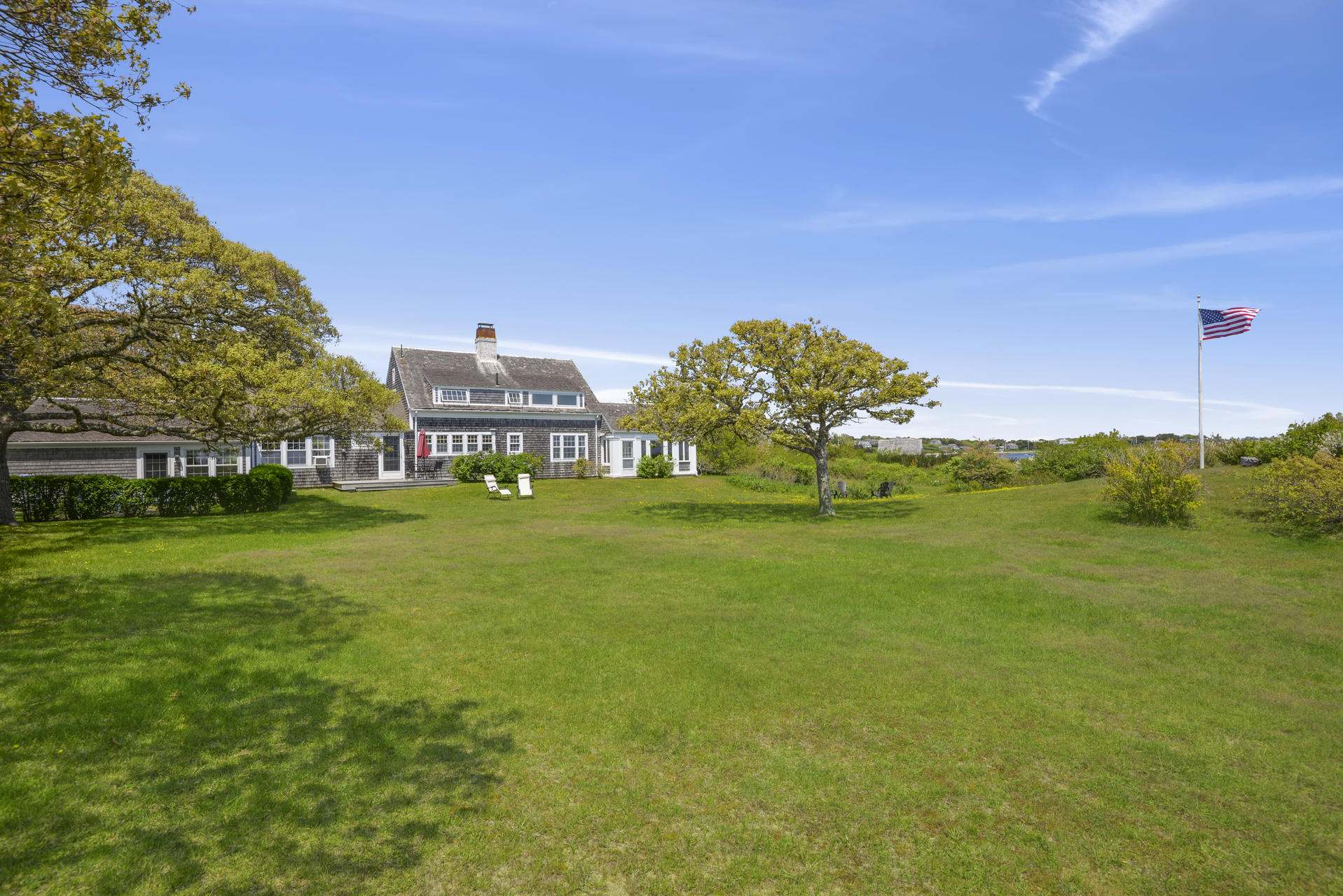 55 Sears Point Road Chatham, MA 02633 - Photo 6 of 26 a view of a big house with a big yard