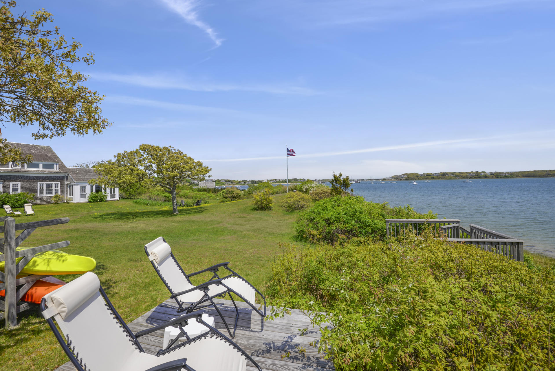 55 Sears Point Road Chatham, MA 02633 - Photo 7 of 26 a view of a lake with couches in front of house