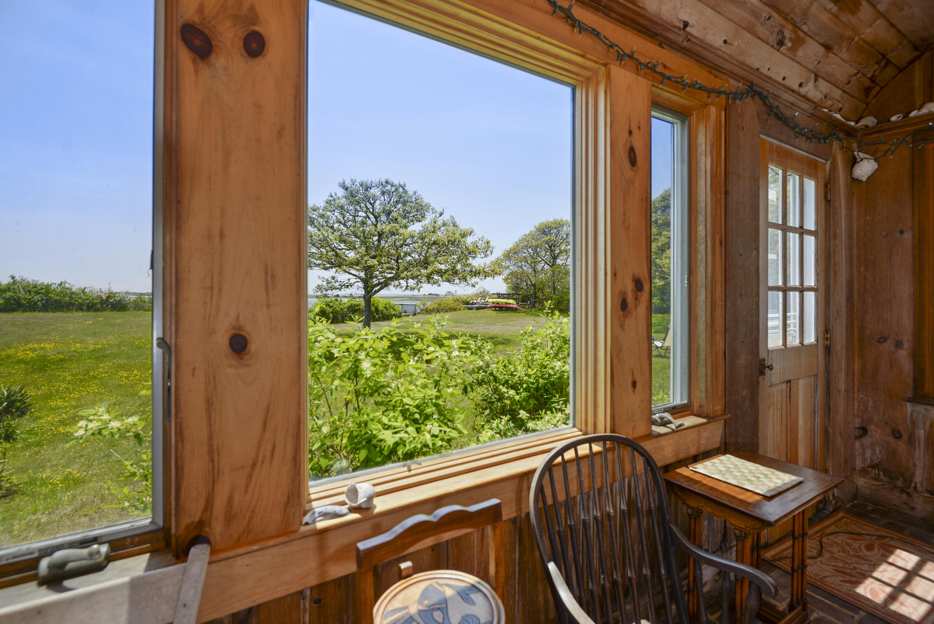 55 Sears Point Road Chatham, MA 02633 - Photo 9 of 26 a view of a balcony with two chairs and a table