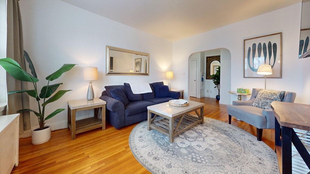 90 Kilsyth Road, Unit 44FURNISHED Boston, MA 02135 - Photo 5 of 10 a living room with furniture and a wooden floor
