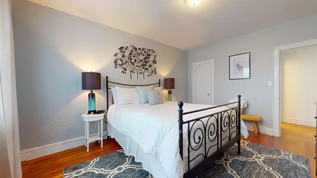 a bedroom with a bed and a table in it