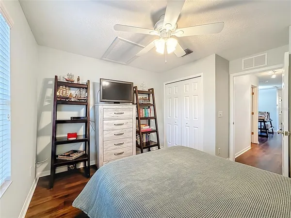 a spacious bathroom with a double vanity sink a mirror and a