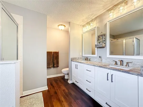 a bathroom with a bathtub and a shower