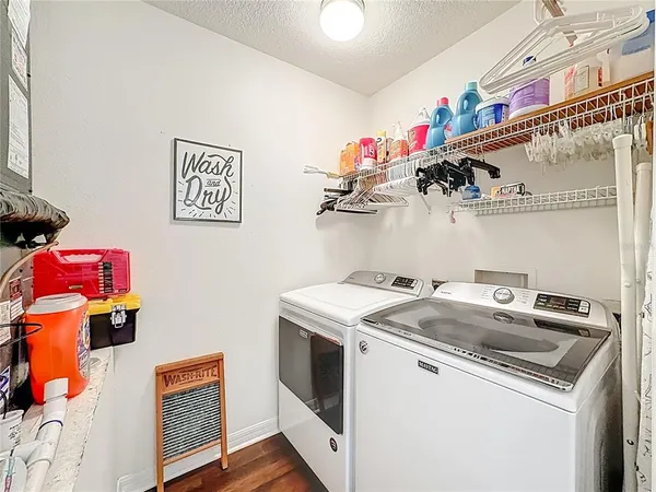 a view of a porch with chairs and backyard