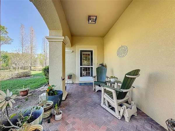 a living room with furniture and a garden
