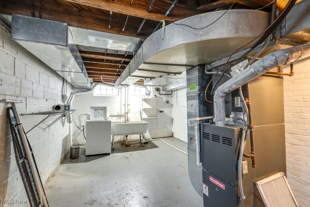 13677 Cedar Road Cleveland, OH 44118 - Photo 48 of 50 Below grade area featuring heating unit and washer / clothes dryer