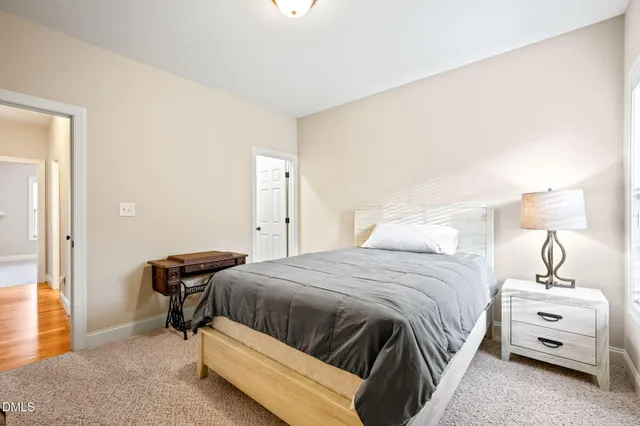 a bedroom with a bed and a chair