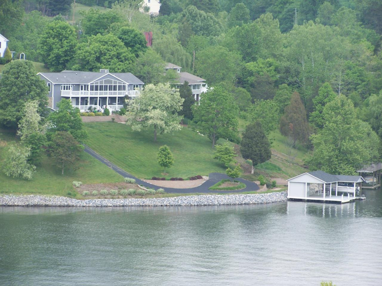 1194 Carters Island Road Goodview, VA 24095 - Photo 4 of 5 a view of a lake with a house