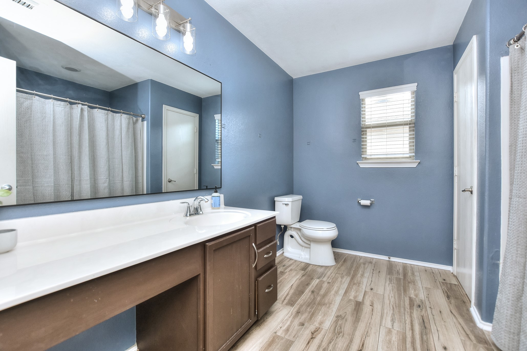 74 Jan Lane Georgetown, TX 78626 - Photo 26 of 31 a bathroom with a sink and a mirror